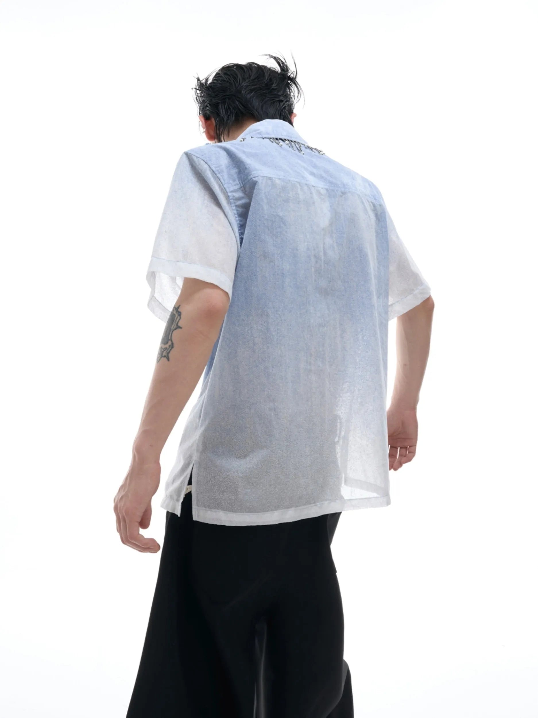 Blue and white gradient short-sleeved casual shirt on a hanger.