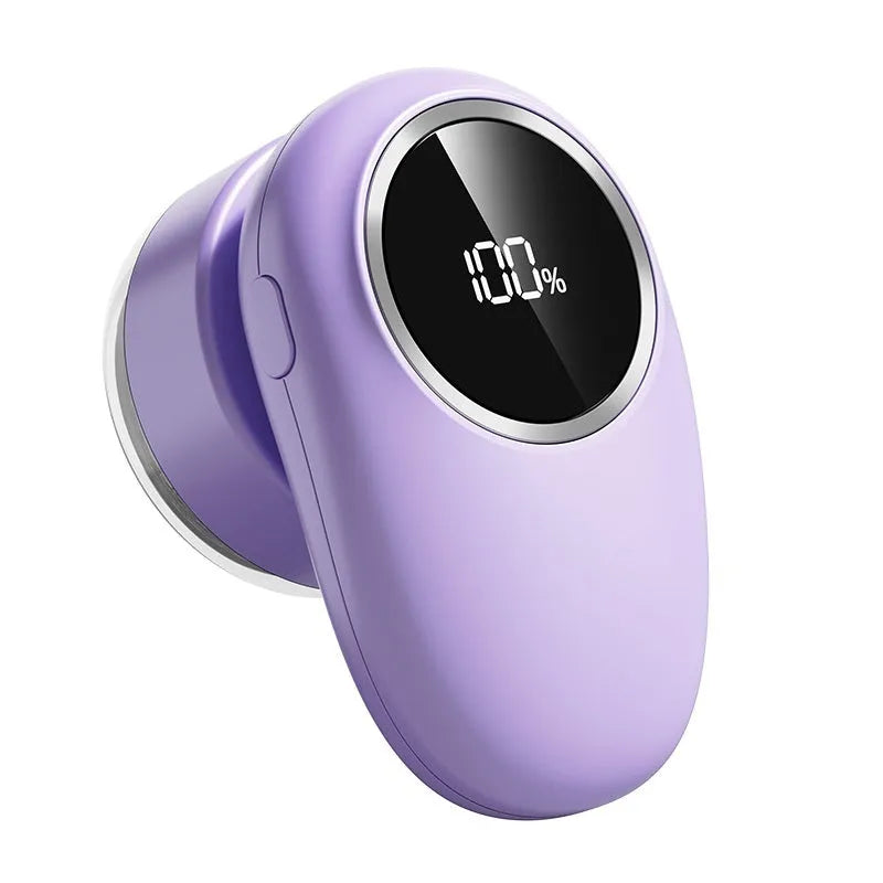 Beige and purple digital fur ball trimmer lint remover with selectable cutter heads on a table
