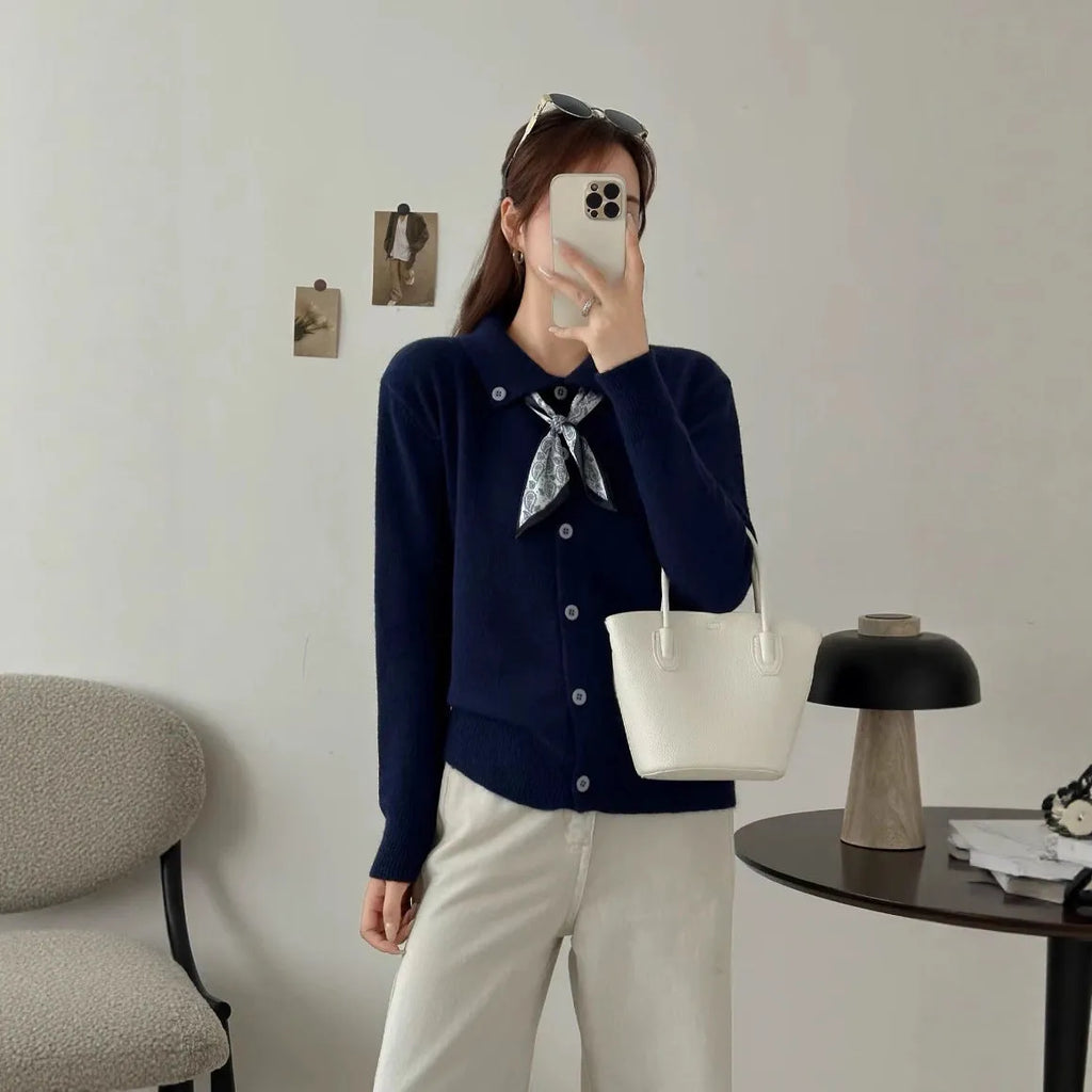 Lapel scarf sweater cardigan in acrylic knit, shown in milky white with splicing detail and long sleeves.