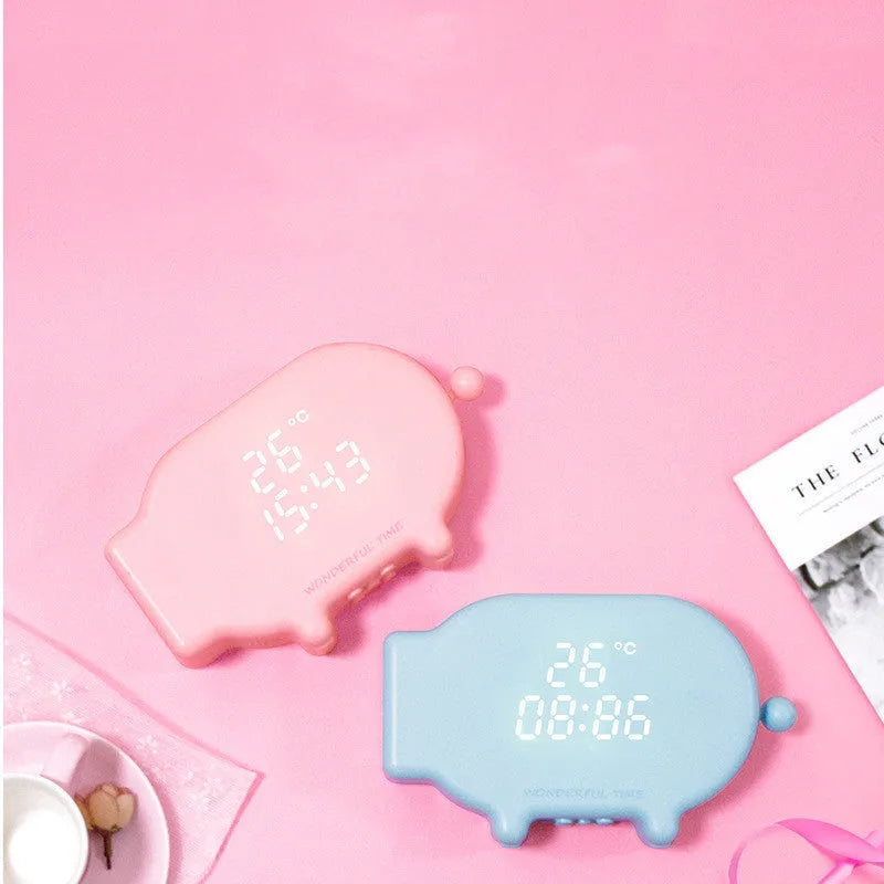 Blue and pink multifunctional LED alarm clock showing time, temperature, and a USB charging port.
