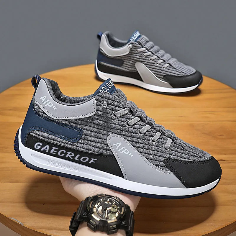 Men's green and grey low-top mesh running shoes with lace-up front and round toe.