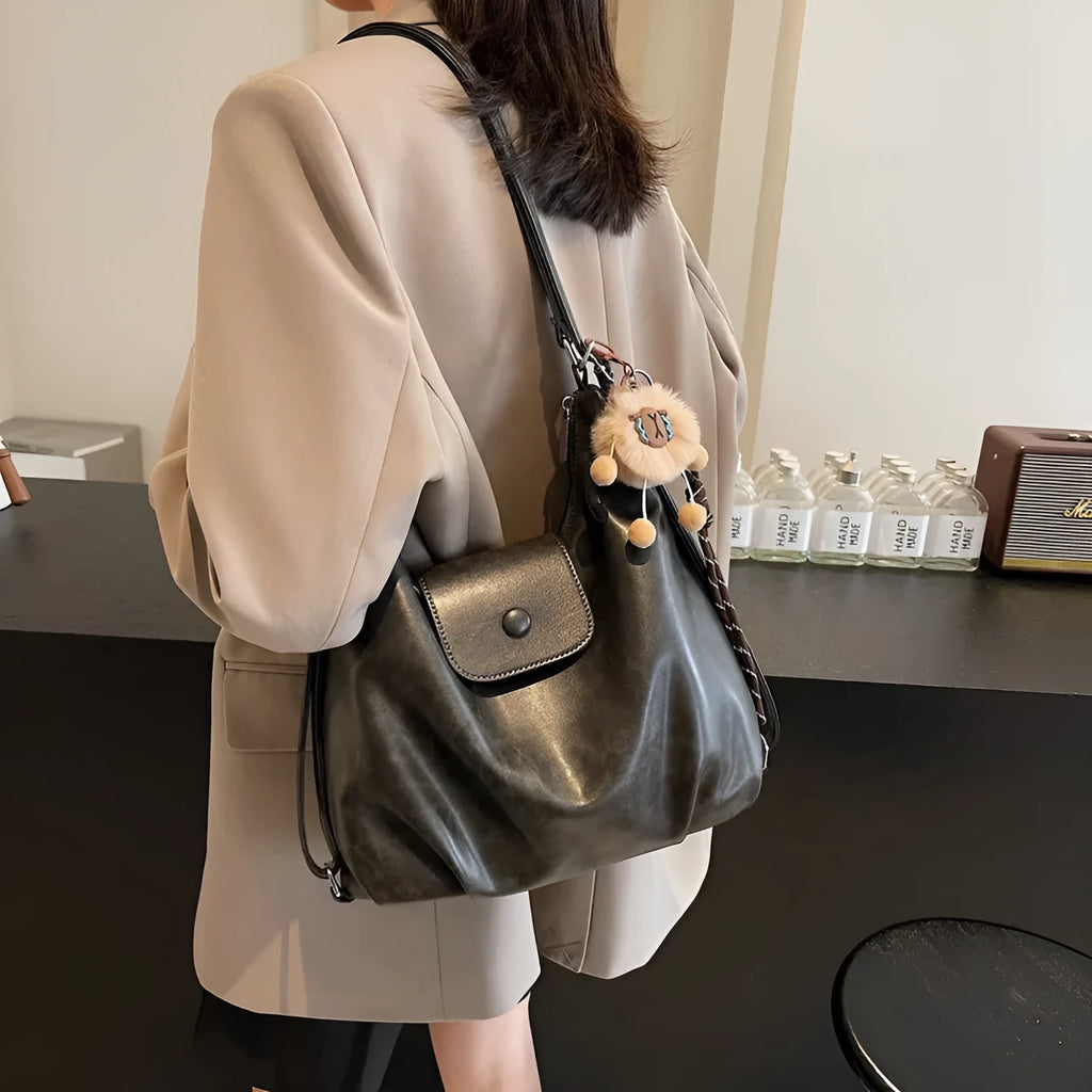 Women's PU leather shoulder bag with single strap, horizontal square design, and internal phone pouch in black colour