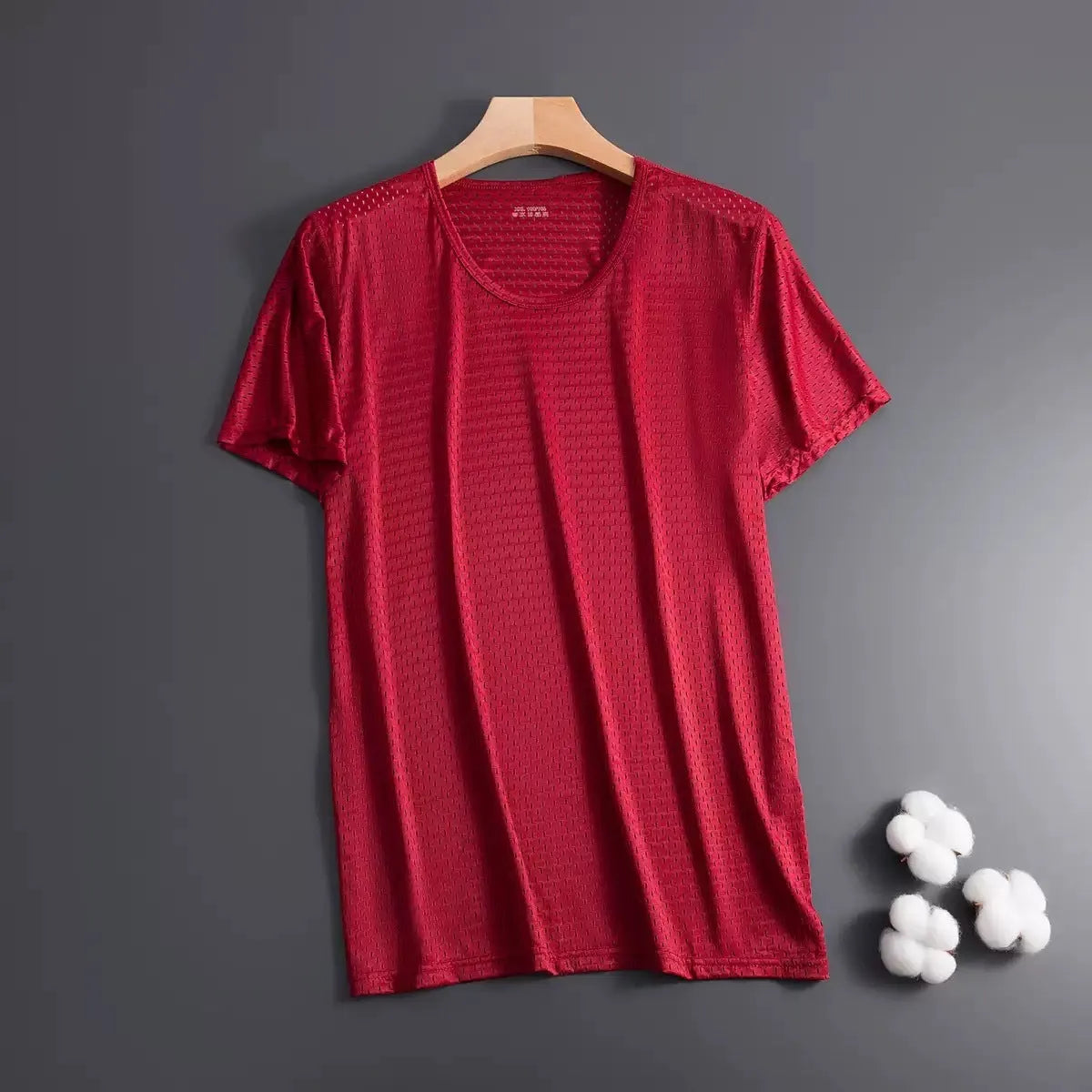 Men's solid colour Ice Silk short sleeve crew neck t-shirt on a hanger.