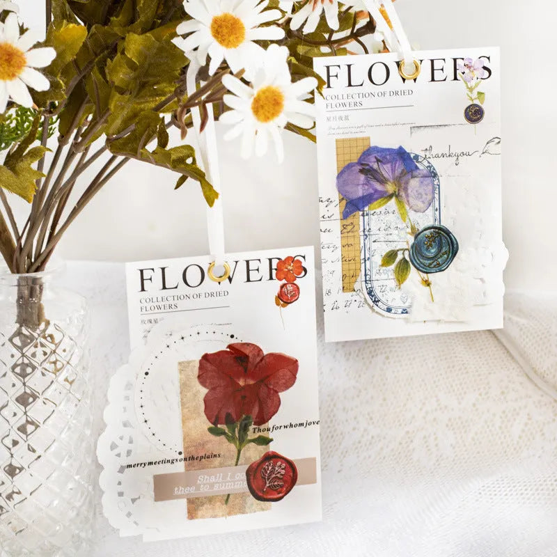 Set of 40 printed PET decorative stickers showing eight artistic styles including dried flowers and leaf specimens.