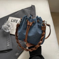 Blue one-shoulder cross body bucket bag with synthetic leather lining and sandwich pocket