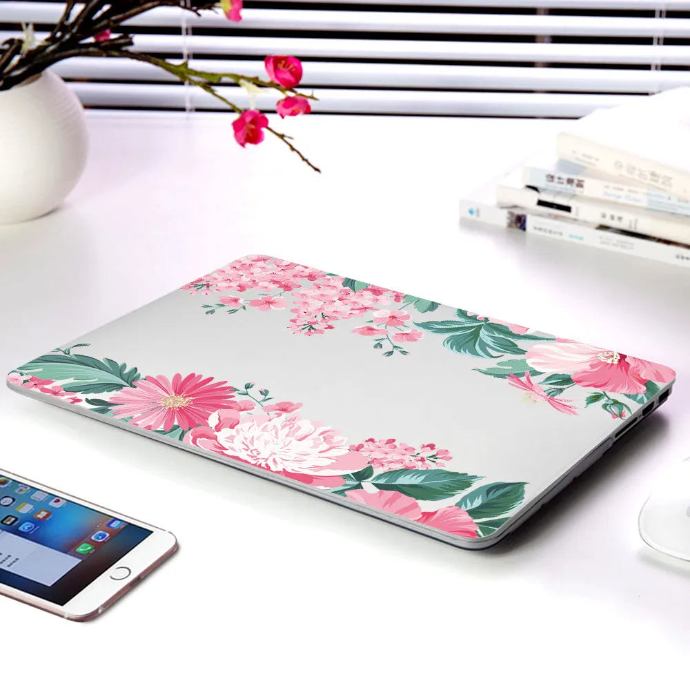 Plastic laptop protective shell with a floral pattern design for MacBook Air and MacBook Pro models.
