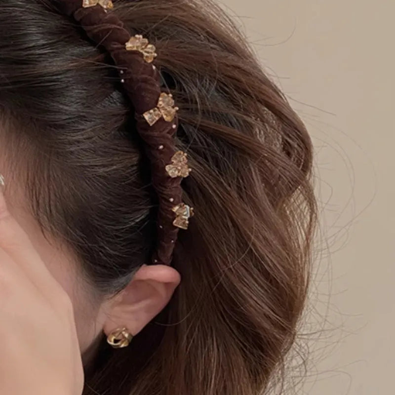 Women's velvet hair band with crystal wave decoration in red, black, and coffee colours.
