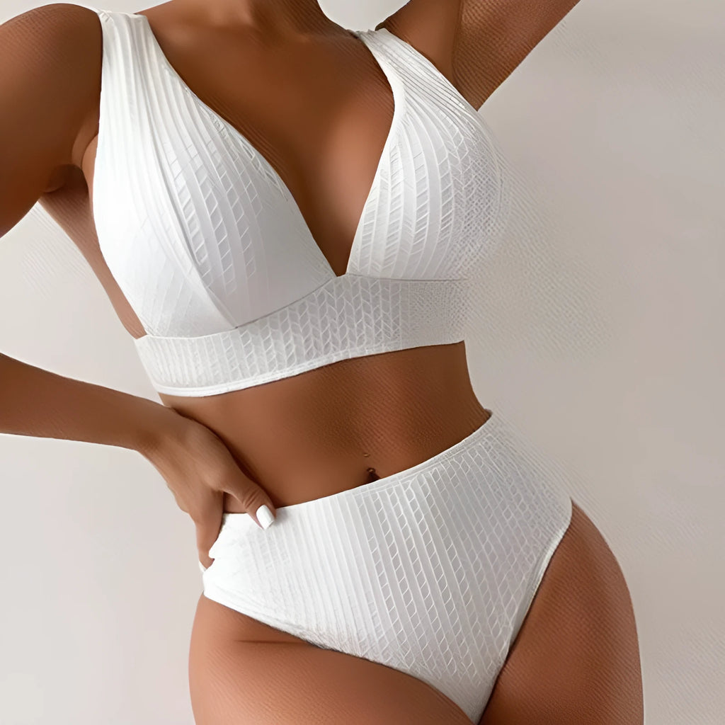 White backless bikini swimsuit with briefs bottom on a mannequin.