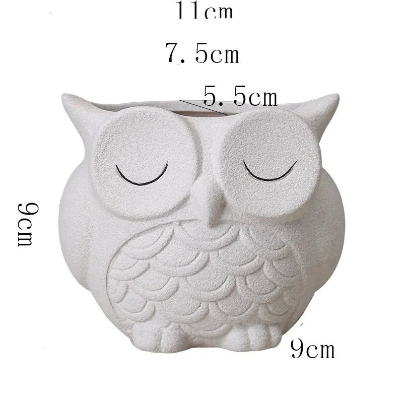 Handmade frosted owl ceramic succulent pot in light pink, showing cartoon design and 11cm size.