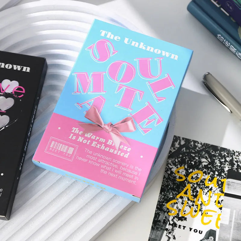 Box of fresh style creative postcards showing two different printed message designs.