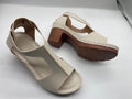 Women's peep toe wedge sandal with buckle on low heel, open fish mouth toe, in light brown