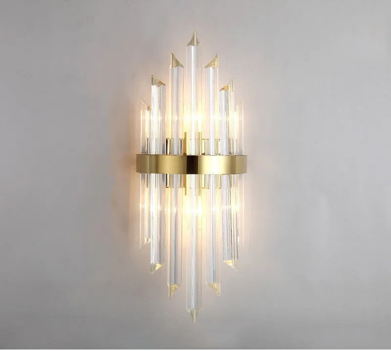 Modern crystal wall lamp with petal design and titanium gold finish mounted on wall