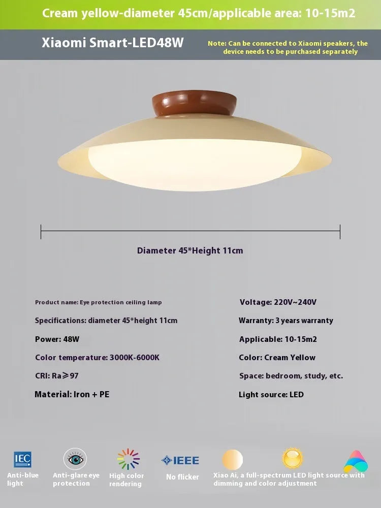 Modern cream style flying saucer shaped ceiling lamp in an iron shade.