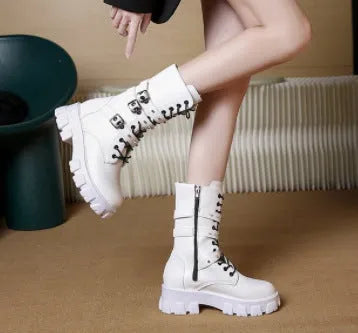 Women's black mid-calf buckle knight boots with side zipper on a white background.