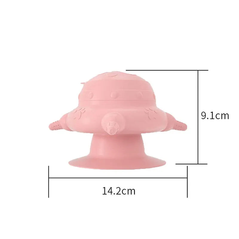 Pink silicone pet nursing device with pacifiers for feeding puppies and kittens.