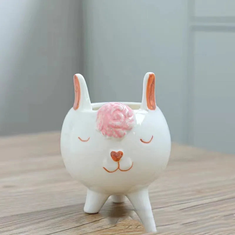 Hand-painted ceramic succulent flowerpot with cartoon animal and flower design in pastoral style.