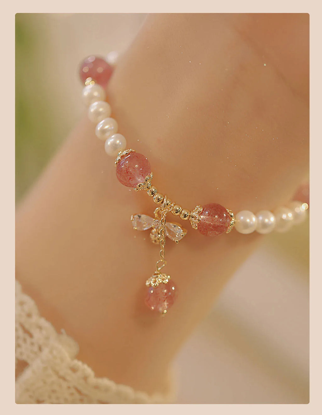 Strawberry quartz crystal bead bracelet for women with a central bow decoration.