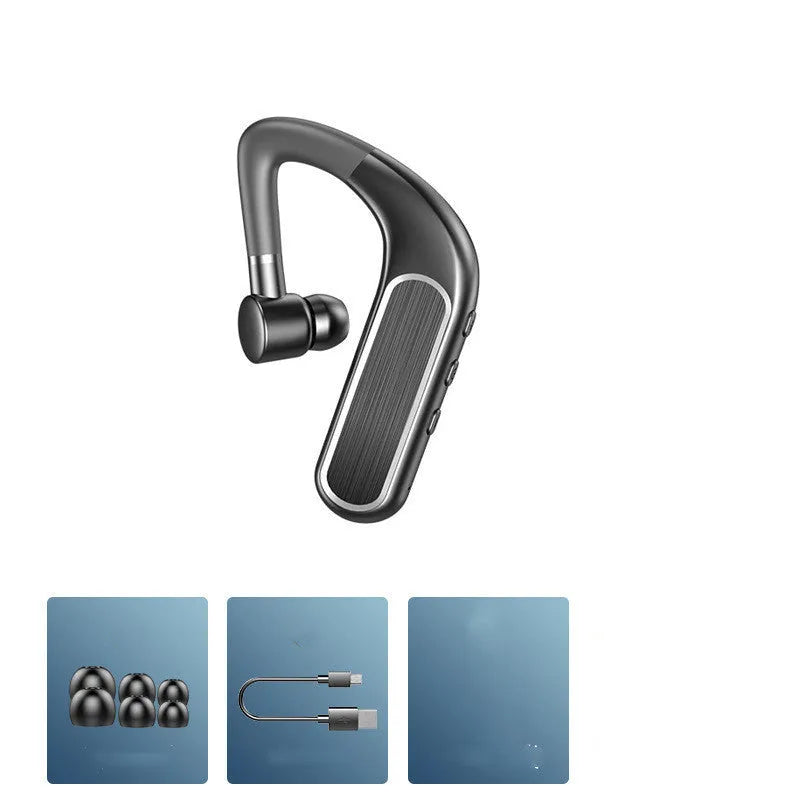 Black Bluetooth earphones with a charging warehouse case and silicone ear caps on a table.