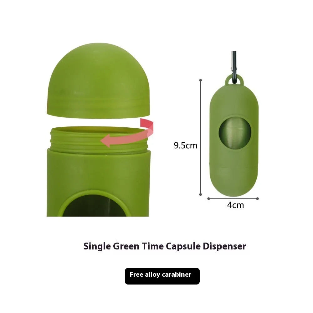 A roll of green EPI degradable pet waste bags next to a black dispenser on a grass background.