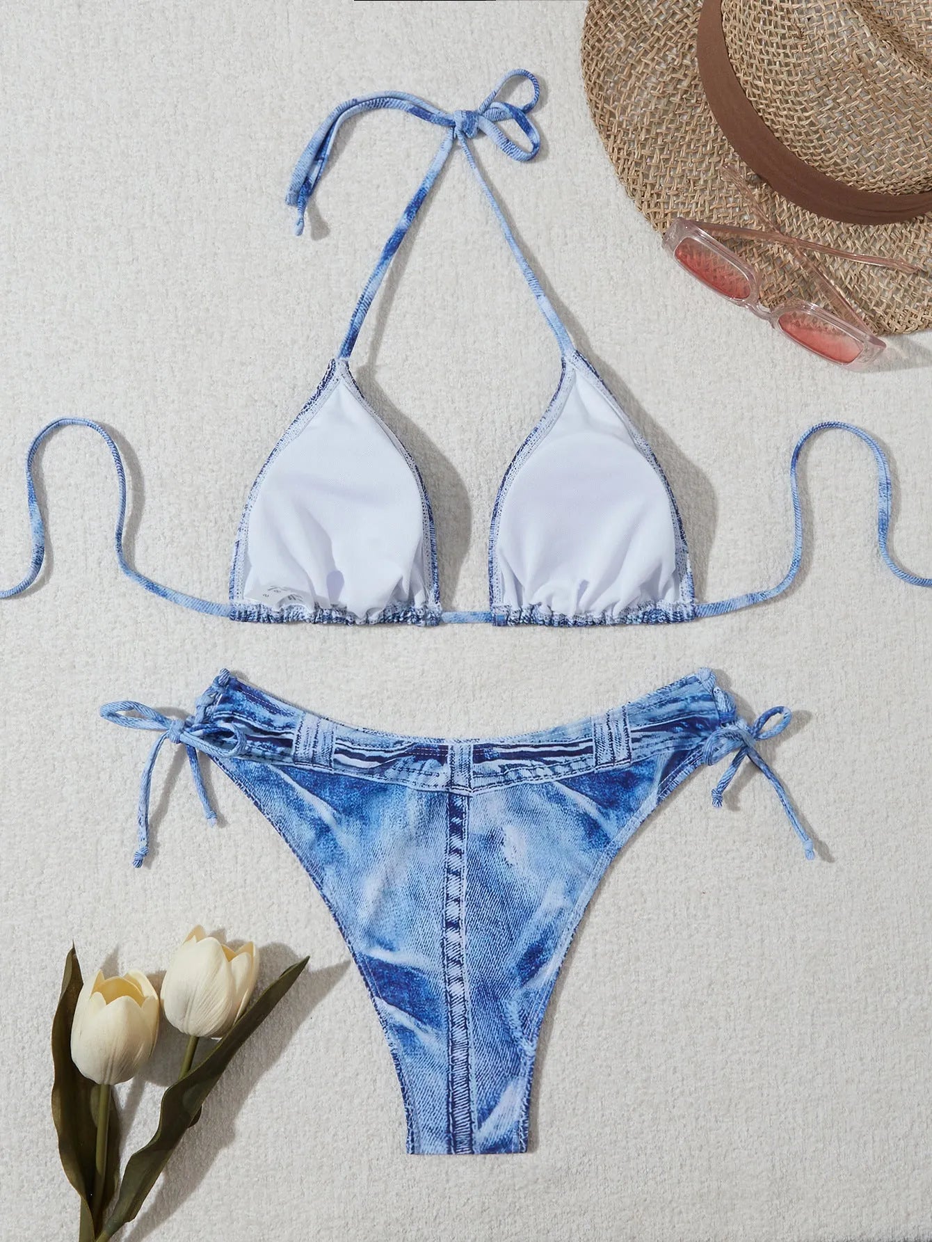 Women's denim blue printed bikini set with strap detail, made from nylon spandex fabric.