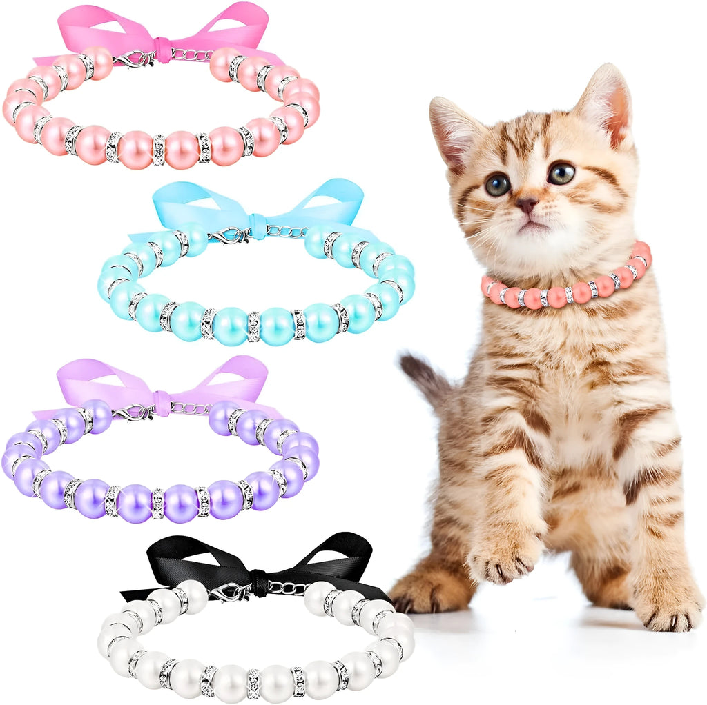 Small dog wearing an adjustable blue imitation pearl and rhinestone necklace with a ribbon bow.