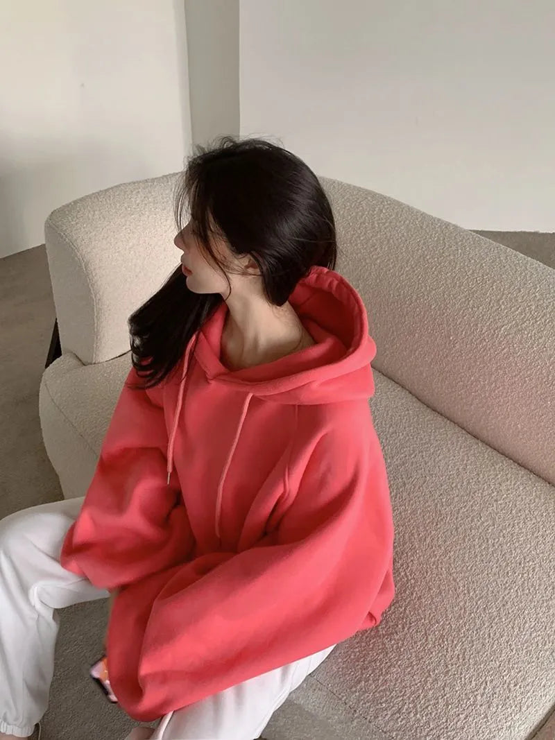 Watermelon red women's sleeveless hooded sweater made from mulberry silk fabric.