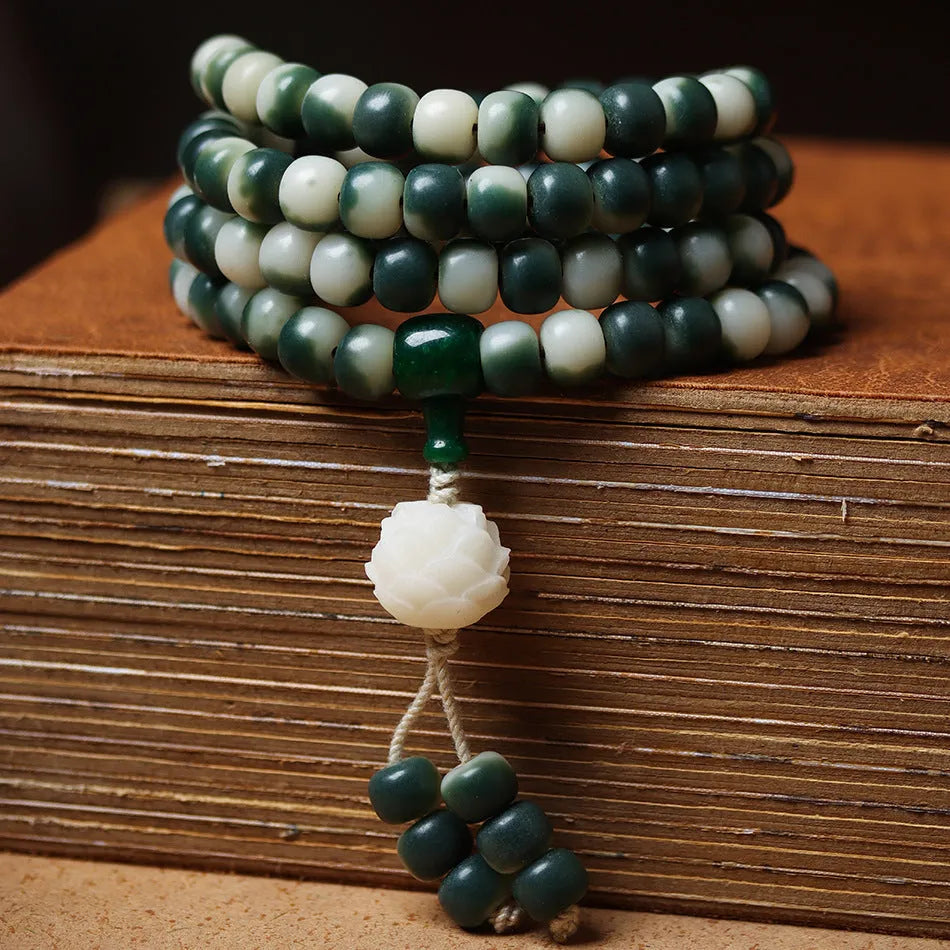 Lotus White Jade Bodhi Beads Bracelet showing floating flowers pattern on Bodhi root beads