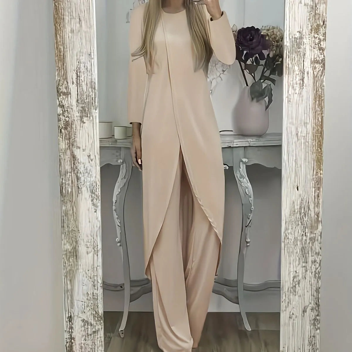 Women's casual two-piece lounge set showing long sleeve top and trousers in loose fit
