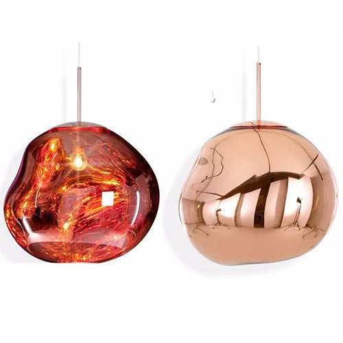 A modern irregular shaped glass chandelier with a Nordic design in a gold finish, hanging from a ceiling.