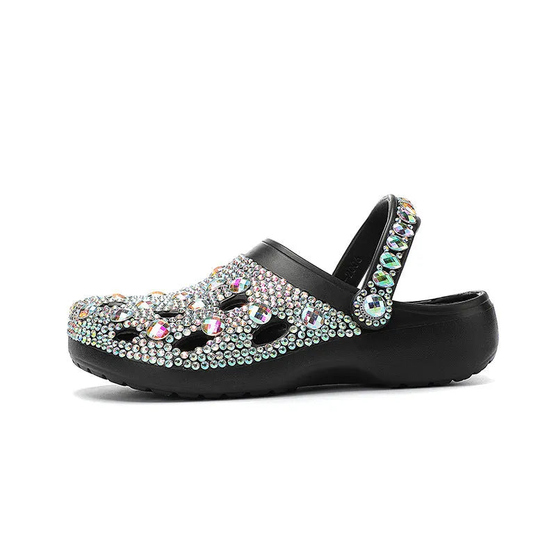 Black platform sandals for women with rhinestone detail and open-hole design on a lightweight EVA sole.
