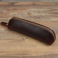 Genuine cowhide leather pencil case with zipper closure measuring 18cm long
