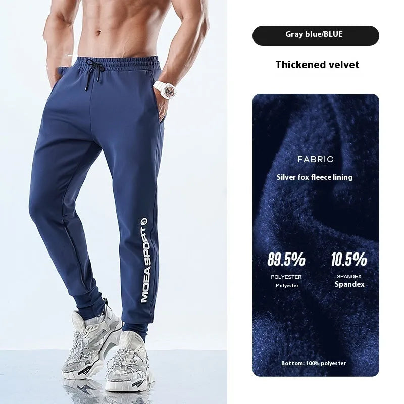 Men's grey blue ankle-tied sweatpants with mid waist, shown on a model.