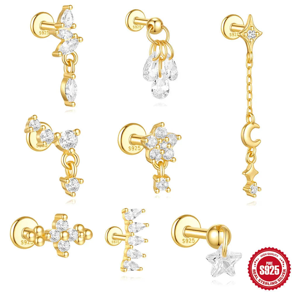 Geometric S925 sterling silver star and moon earrings with diamond accents in a gold colour.