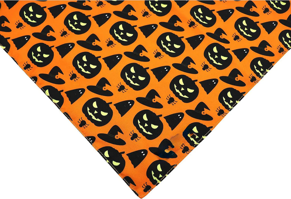 Reversible Halloween dog bandana showing pumpkin design on one side and spider web pattern on the other