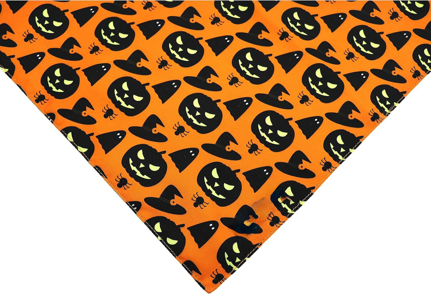 Reversible Halloween dog bandana showing pumpkin design on one side and spider web pattern on the other