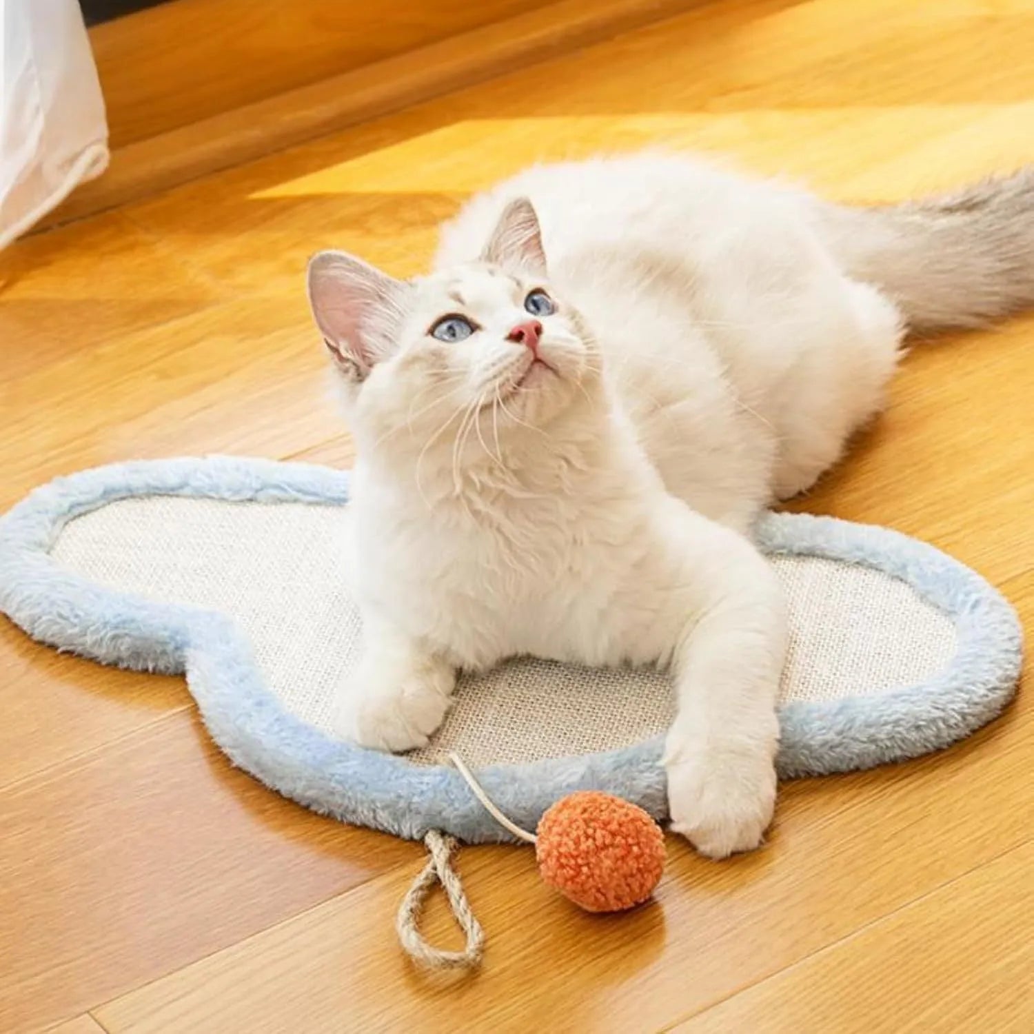 White cat scratching mat with cartoon sleeping cat design, made from natural sisal fibre