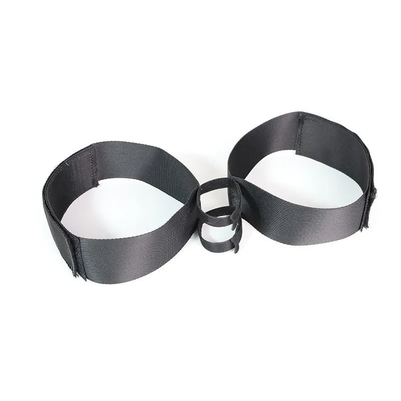 Black knitted belt strap for use as a sensual accessory.