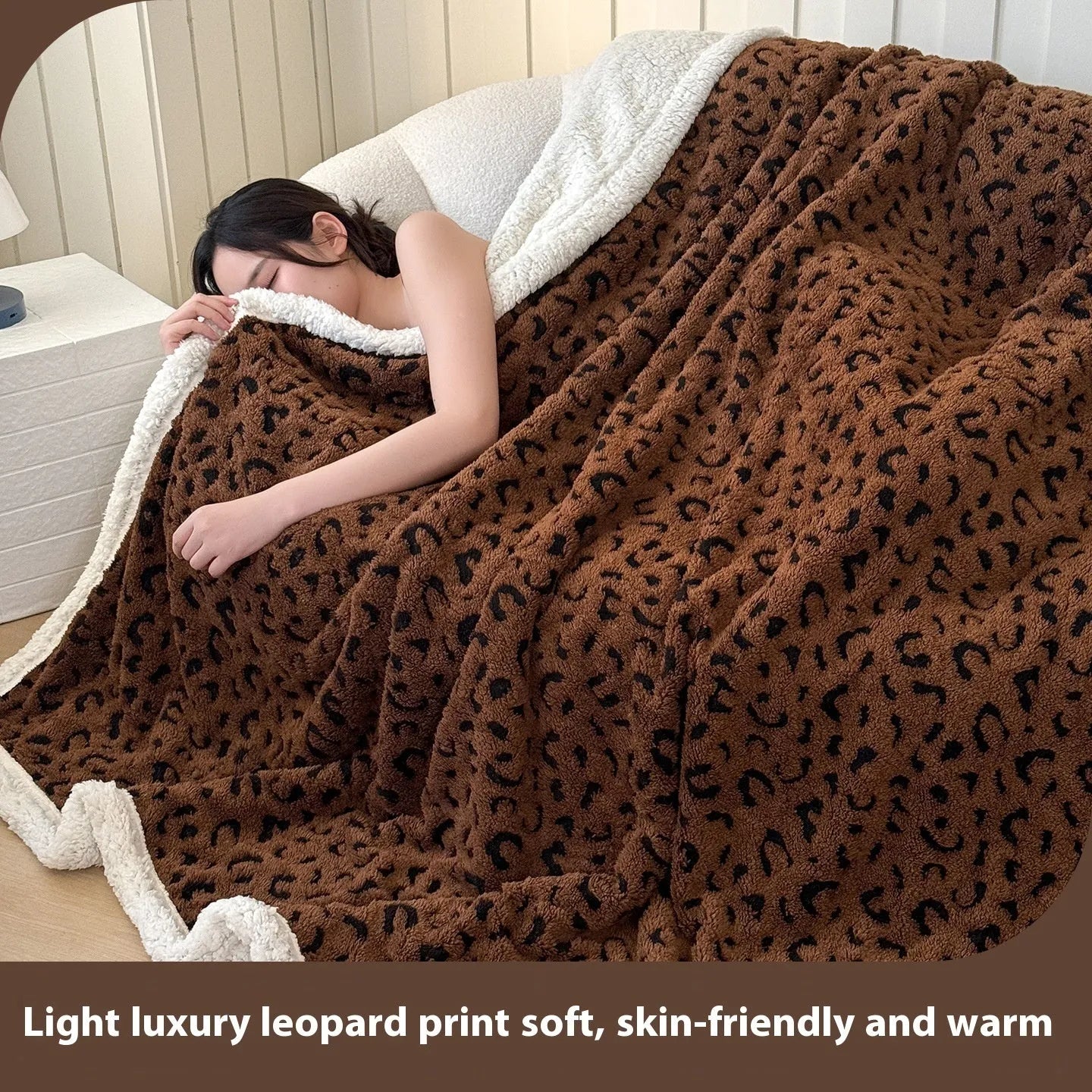 Double-layer cationic leopard jacquard taffeta blanket showing reversible design with zebra pattern