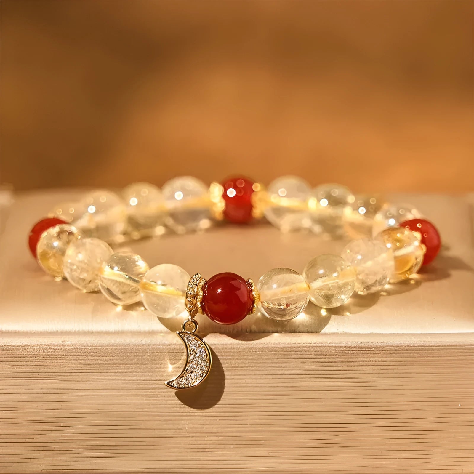 Citrine Red Agate Moon Boom Bracelet showing crystal stones and celestial charms