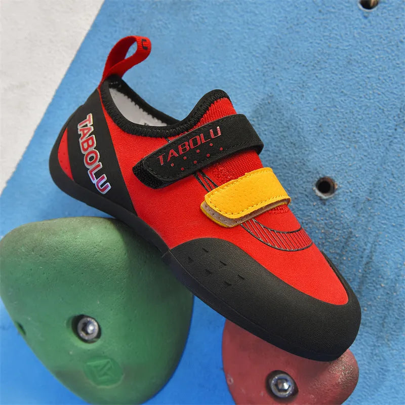 Men's and women's beginner rock climbing shoes with Velcro straps and coloured trim.
