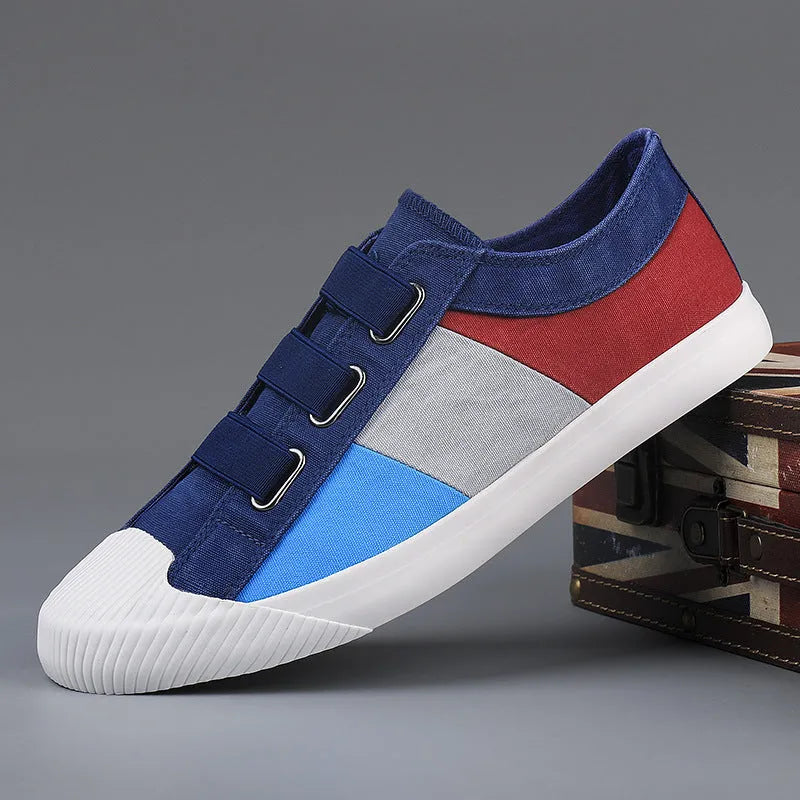 Men's canvas sneakers with rubber sole in multiple colour options showing low top design and elastic band