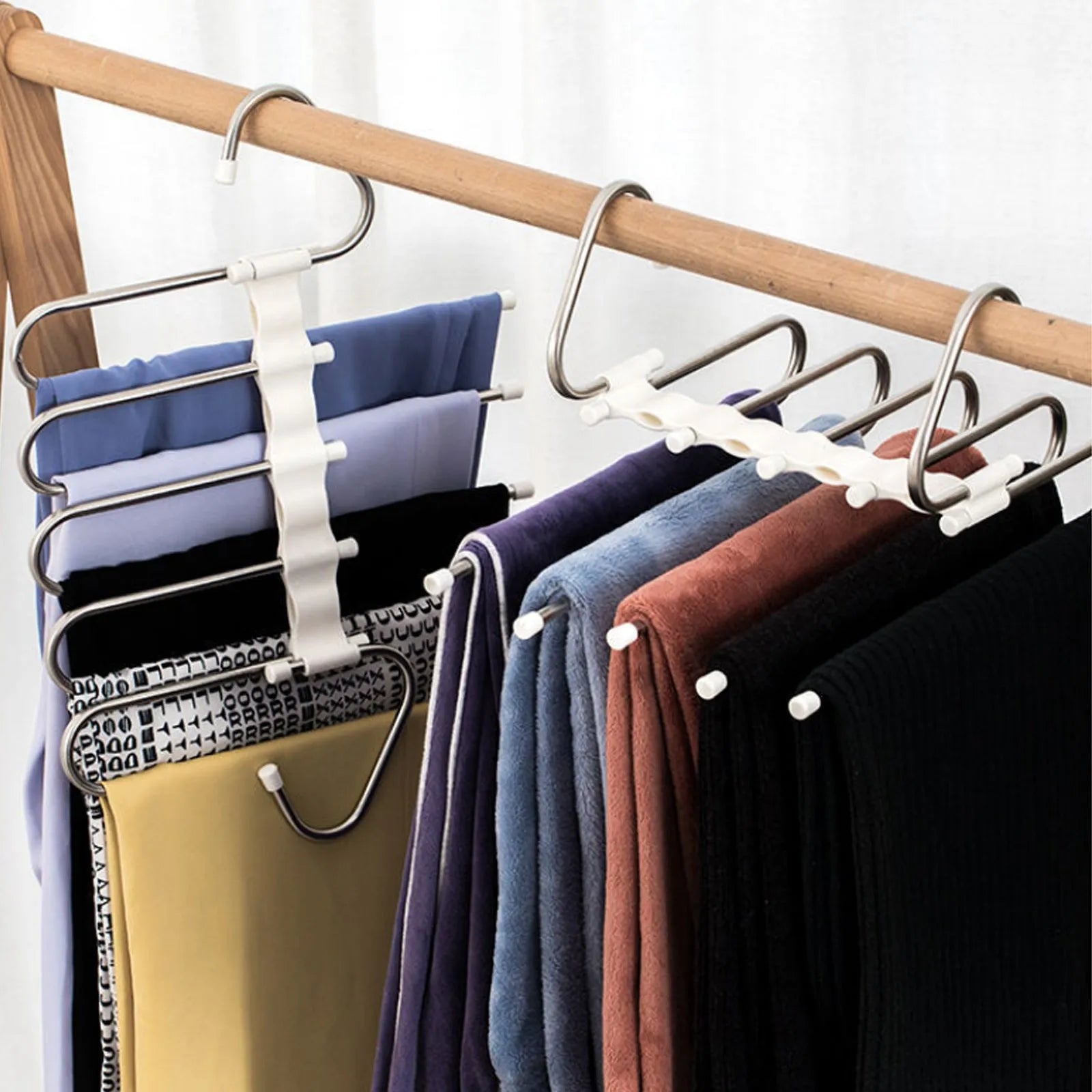 Black stainless steel wardrobe hanger with five booms for trousers organisation