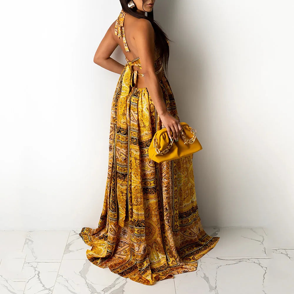 Sleeveless printed halter split dress in yellow brown with mid waist and long skirt, sizes S to 3XL.