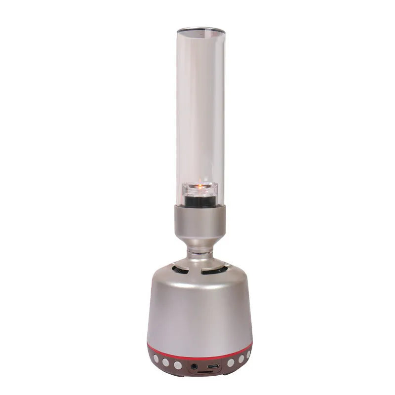 White Silver Candlelight Bluetooth speaker night light on a surface, showing its columnar design and soft glow.