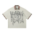 Men's loose blue cotton short-sleeved top with a graffiti print on the lapel.