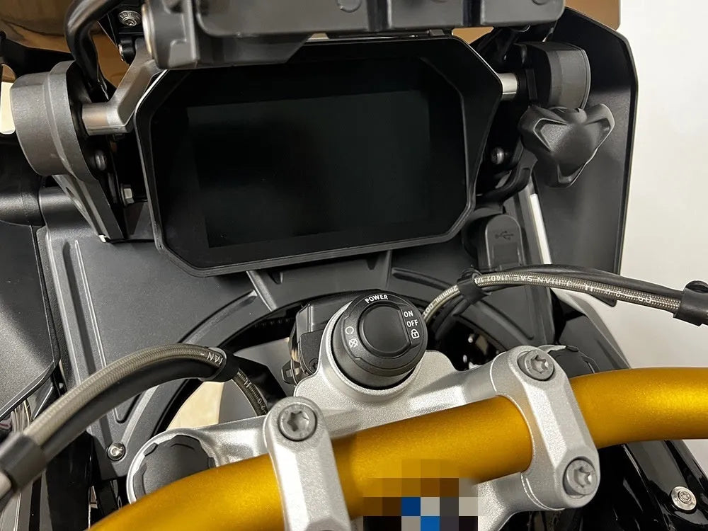 Black ABS plastic cockpit fairing panel for BMW R1250GS motorcycle, shown from a front three-quarter angle.
