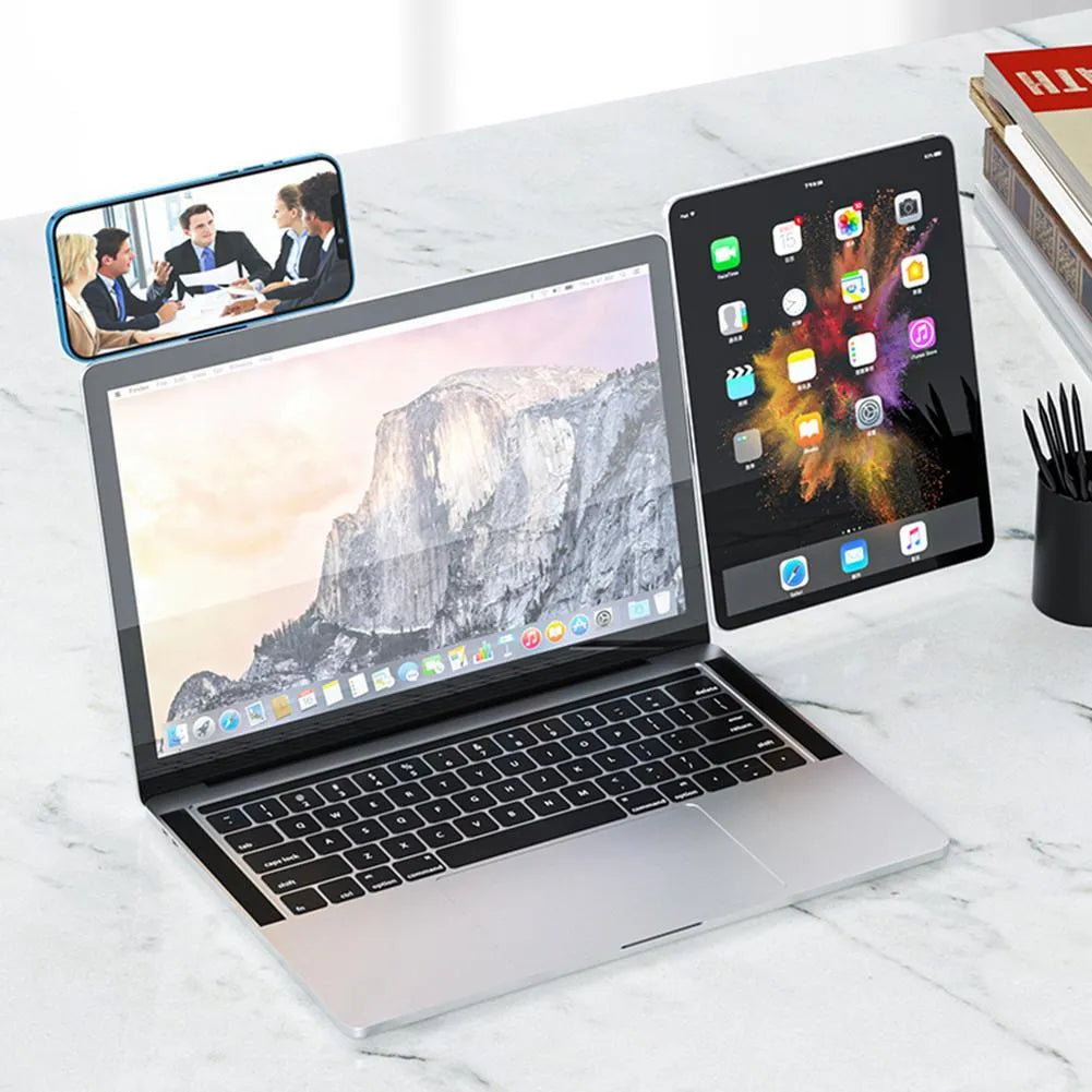 Black aluminium magnetic phone holder mounted on side of laptop screen.