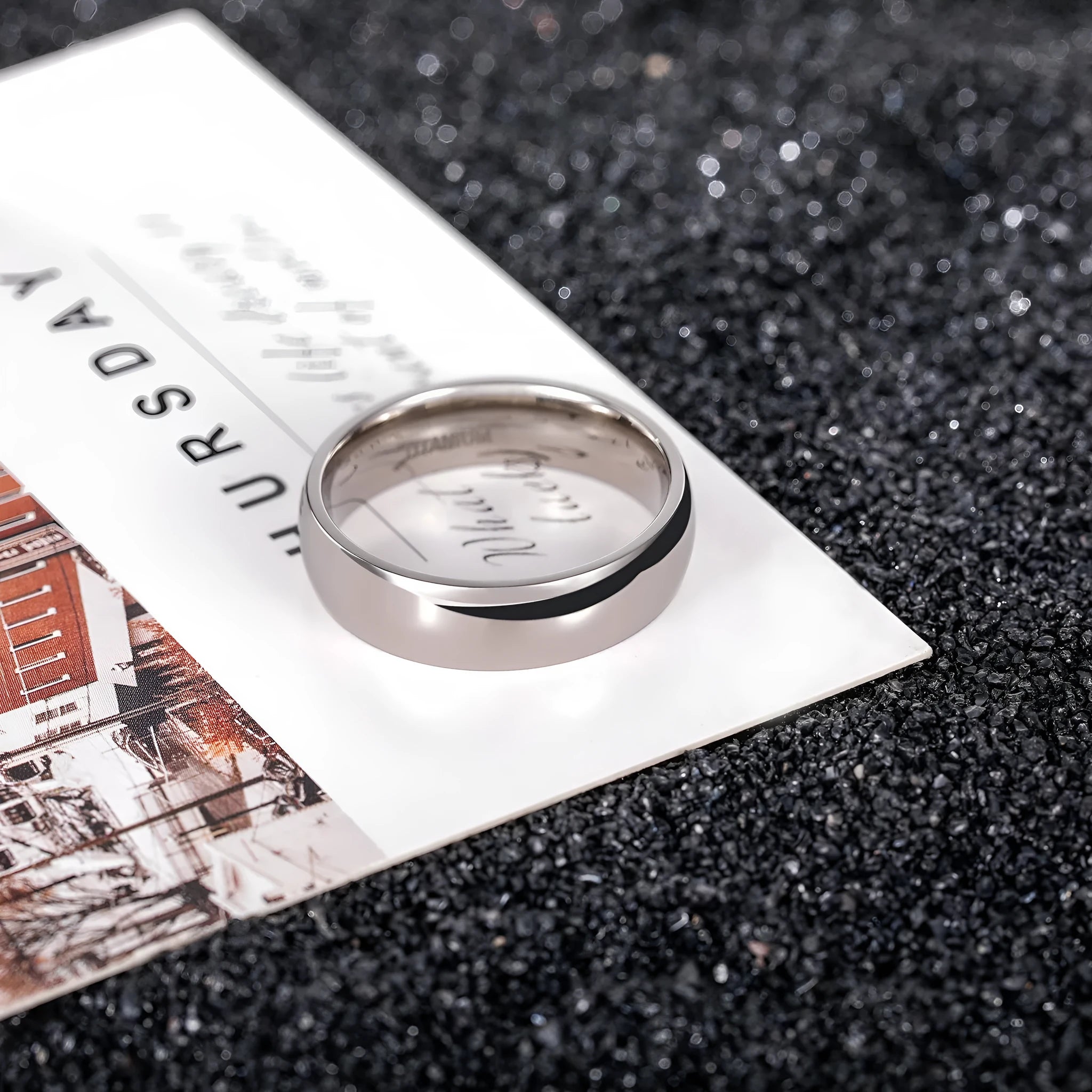 Silver titanium steel unisex ring shown in 2mm, 4mm, and 6mm width options.