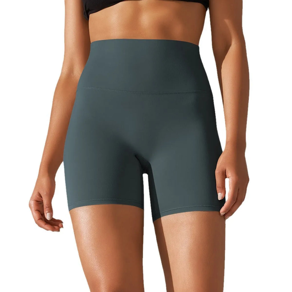 Women's high waist fitness pants in dark green with belly contracting design for athletic activities
