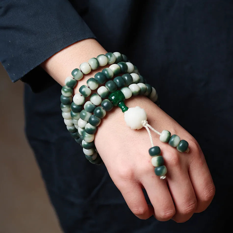 Lotus White Jade Bodhi Beads Bracelet showing floating flowers pattern on Bodhi root beads